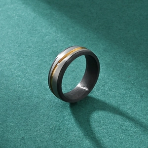 Minimalist carbon fiber and titanium men's ring with gold line and inset crystal