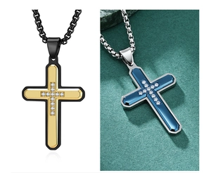 Detail of two-tone stainless steel cross pendants with zircons on box chains