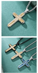 Close-up of hexagonal faceted cross pendants in three-tone steel with zircon inlay