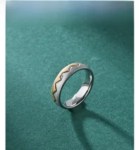 Macro view of two-tone sawtooth titanium steel ring with sparkling center stone inlay