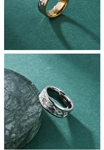 Detailed view of titanium steel rings with textured bark pattern and engraved Fu character