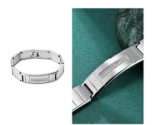 Detailed macro of men's brushed steel bracelet with inlaid zircon crystals on stone