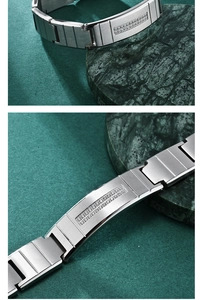 Macro detail of brushed stainless steel men's bracelet with double row of pavé set crystals