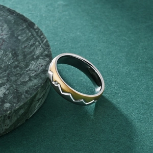 Polished titanium steel ring with sawtooth texture and inset cubic zirconia stone