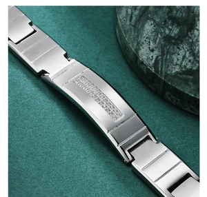 Macro shot of brushed stainless steel men's bracelet with double rows of inlaid crystals