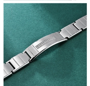 Macro detail of brushed stainless steel bracelet with double-row CNC diamond inlay