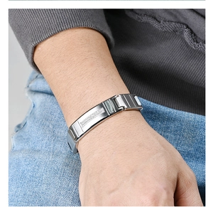 Detailed view of silver stainless steel watchband bracelet with sparkling CNC diamonds
