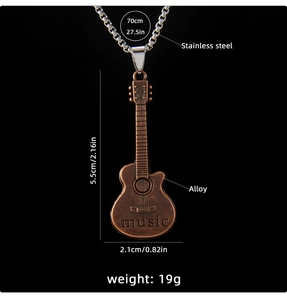 Detailed close-up of retro copper guitar pendant featuring music engraving and box chain