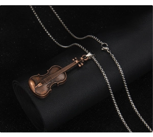 Detailed close-up of a bronze violin pendant necklace with realistic instrument texture