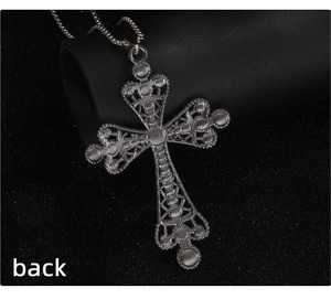 Macro detail of cyberpunk silver cross necklace back with brushed hollow metal texture