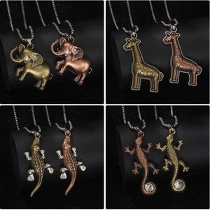Vintage animal pendant necklaces featuring elephant giraffe crocodile and lizard motifs