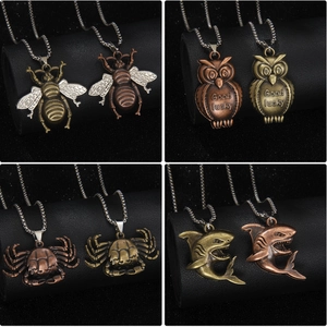 Vintage animal pendant necklace collection in bronze and copper featuring owl and shark