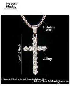 Detailed macro view of silver cross pendant with sparkling rhinestones and box chain