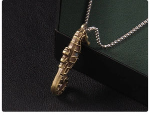 Macro shot of vintage bronze seahorse pendant with textured details on a bead chain