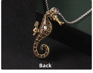 Detail back view of retro bronze seahorse pendant with textured grid and small crystal