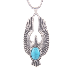 Collier aigle vintage avec pierre turquoise bleue et plumes en argent ciselées