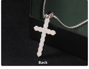 Detailed back view of silver cross pendant with vertical stripes and sleek box chain