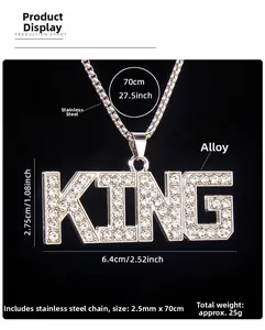 Macro shot of iced out KING pendant with dimensions of 6.4x2.75cm on stainless steel chain
