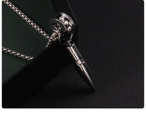 Macro view of gun black bullet pendant with diamond-encrusted ring and box chain