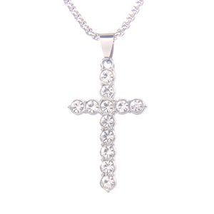 Hip hop silver cross necklace with pavé cubic zirconia diamonds on white background