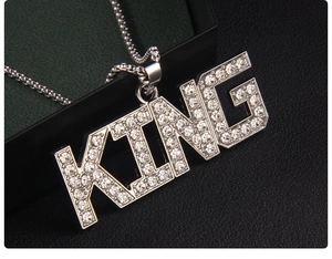Close-up of hip-hop KING pendant necklace featuring sparkling inset rhinestones