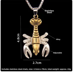Détail du pendentif homard vintage avec pinces mobiles et finition métallique bicolore