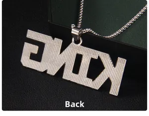 Detailed back view of silver KING pendant with textured finish and woven round chain