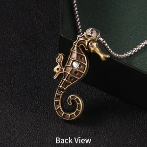 Vintage bronze seahorse pendant necklace with a round white zircon on a silver bead chain