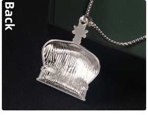 Macro back view of crown pendant showing textured vertical striped steel and bead chain
