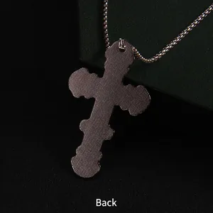 Back view of silver stainless steel cross pendant featuring unique grid texture