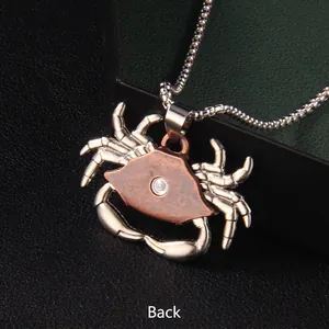 Vintage crab pendant necklace in silver and bronze stainless steel, back view display