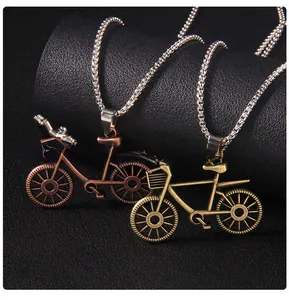 Detail view of retro bicycle pendants in bronze and copper finish with ball chains