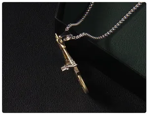 Detailed macro view of a vintage 3D bicycle pendant with silver and gold metal accents