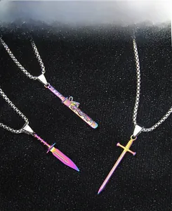 Macro detail of rainbow plated stainless steel sword and dagger necklaces on a black backdrop