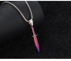 Macro shot of colorful gradient dagger pendant on a stainless steel link chain