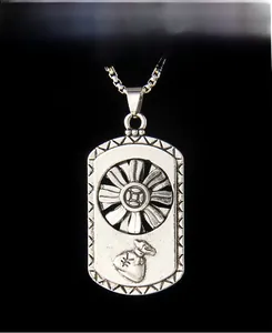 Macro view of vintage silver rotating money bag pendant with decorative box chain