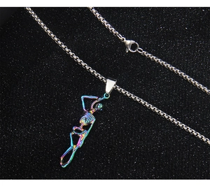 Macro shot of hip hop skull pendant with rainbow metal finish on a silver box chain
