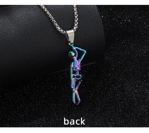 Macro shot of iridescent skull pendant back on a black leather stand with a silver chain