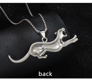 Macro back view of the silver leopard pendant showing smooth stainless steel texture