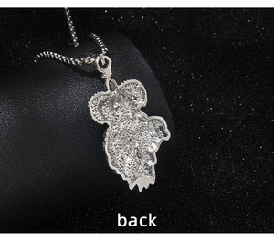Detailed back view of a stainless steel lion pendant with textured silver finish