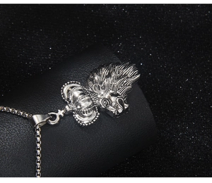Detailed view of silver lion head crown pendant with square box chain in stainless steel