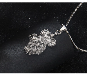Close-up of a silver lion head crown pendant with a high-quality box chain necklace