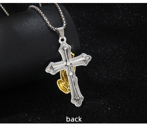 Macro back view of two-tone stainless steel praying hands and cross pendant details