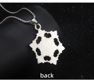 Close-up of the silver snowflake pendant back view with hollow heart details