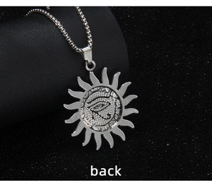Detail view of the flat textured back of the silver Viking Eye of Horus sun pendant