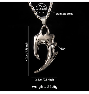 Close-up of gothic claw pendant with zircon inlay and detailed size specifications