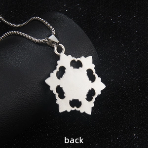 Silver snowflake pendant necklace back view with hollow heart details and box chain
