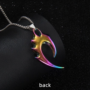 Rainbow plated stainless steel wolf tooth pendant necklace on a black jewelry stand back view