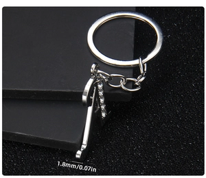 Macro view showing 1.8mm thickness of silver metal letter A keychain with crystals