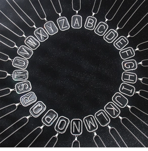Detailed top view of 26 stainless steel black enamel letter pendants with crystals